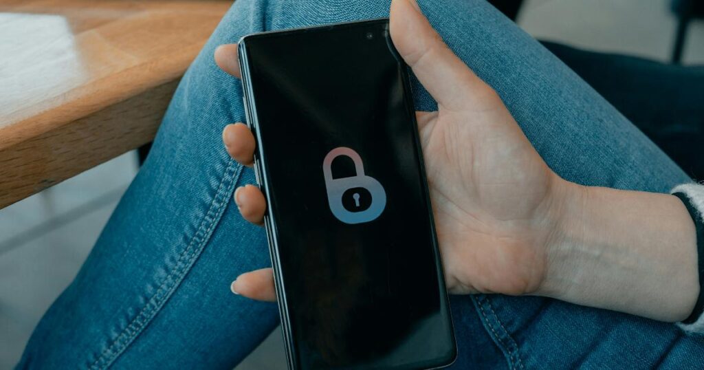 A person reviewing privacy settings on a smartphone, showing practical digital footprint management and online privacy controls
