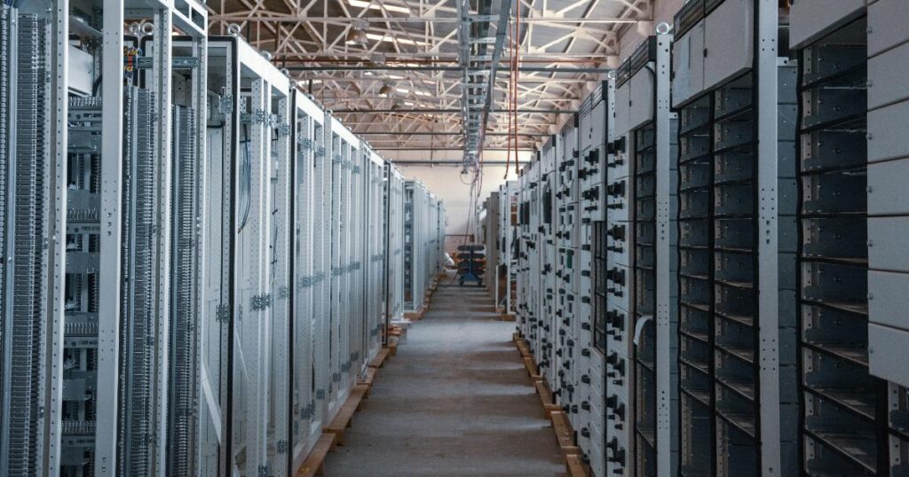 A server room and laptop showing a code repository used as a focus_keyword for AI coding agents
