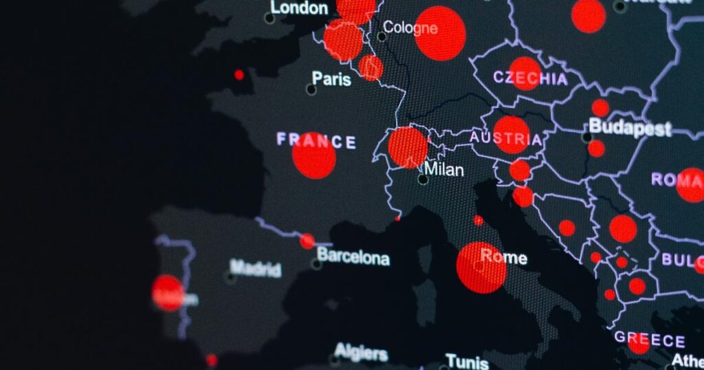 Analyst reviewing European cybersecurity threat maps on a laptop, illustrating the need for a regional cybersecurity lens