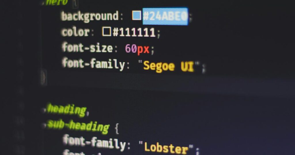 A front-end developer reviewing a CSS features dashboard and browser compatibility notes on a laptop screen