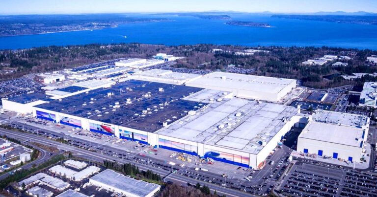 Aerial view of a modern aerospace factory in Washington, reflecting the Pacific Northwest tech economy and its shift toward hardware and AI