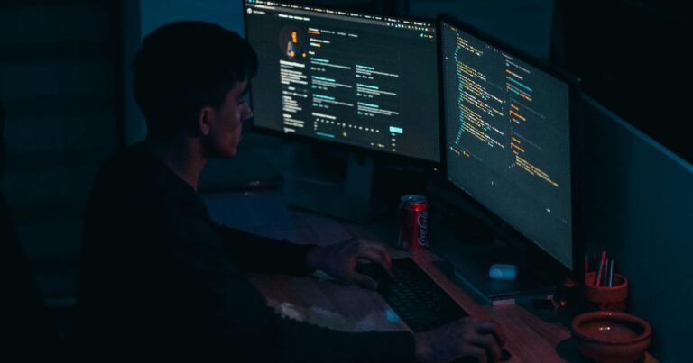 A software engineer reviewing AI-generated code on multiple monitors, illustrating how AI coding tools make code cheap, not judgment